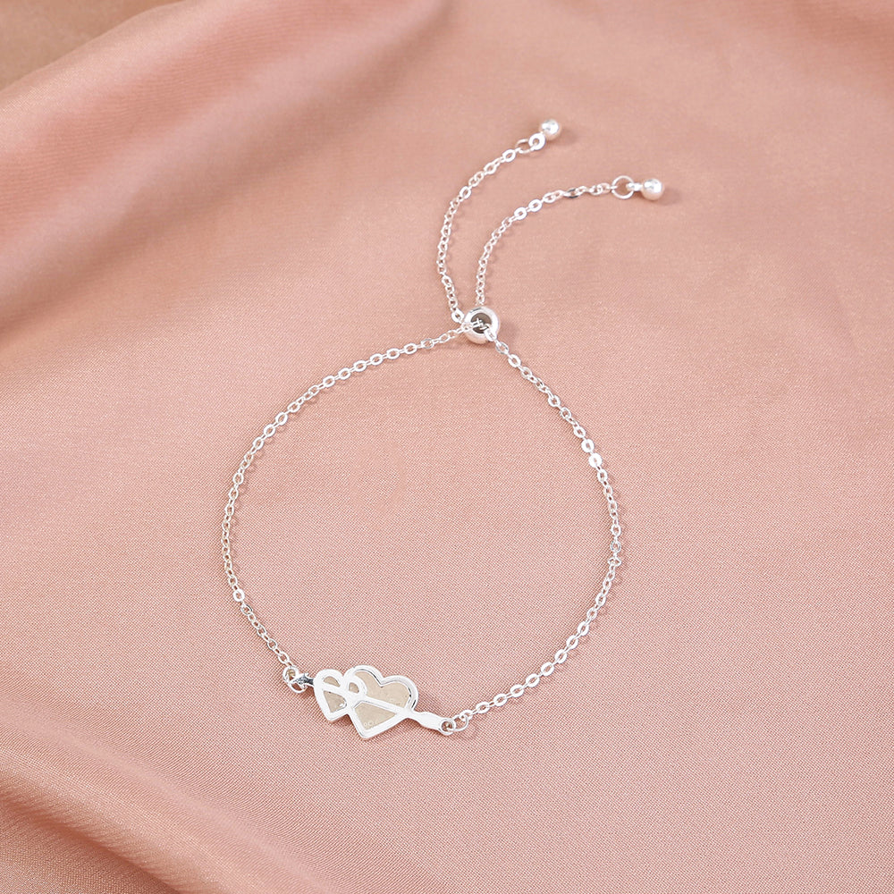 Glow-in-the-dark couple love heart silver bracelet